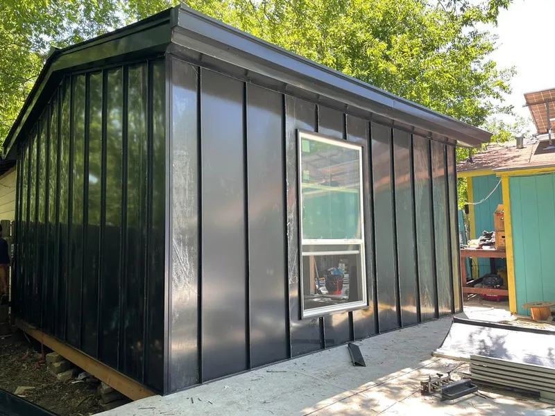 Black standing seam metal wall panels for Roof Inspection in Stuarts Draft