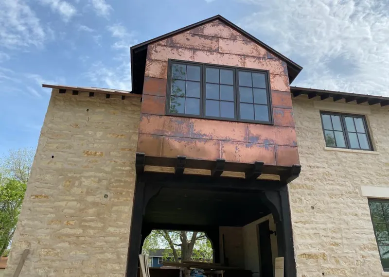 Copper metal panel facade on a stone building for Metal Roof Coating in Stuarts Draft